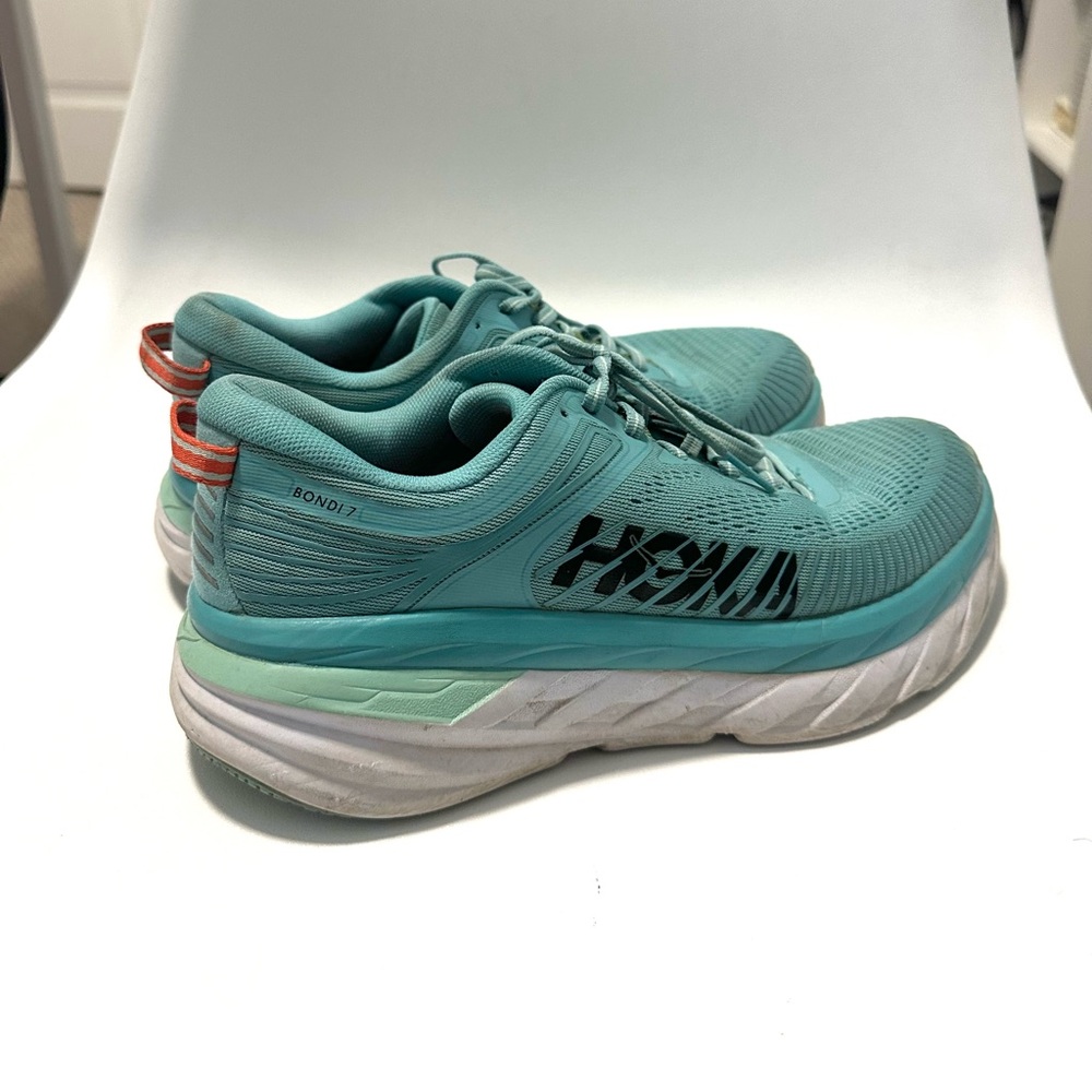 Hoka Bondi 7. Aqua and white. Used, but still some life left in them.